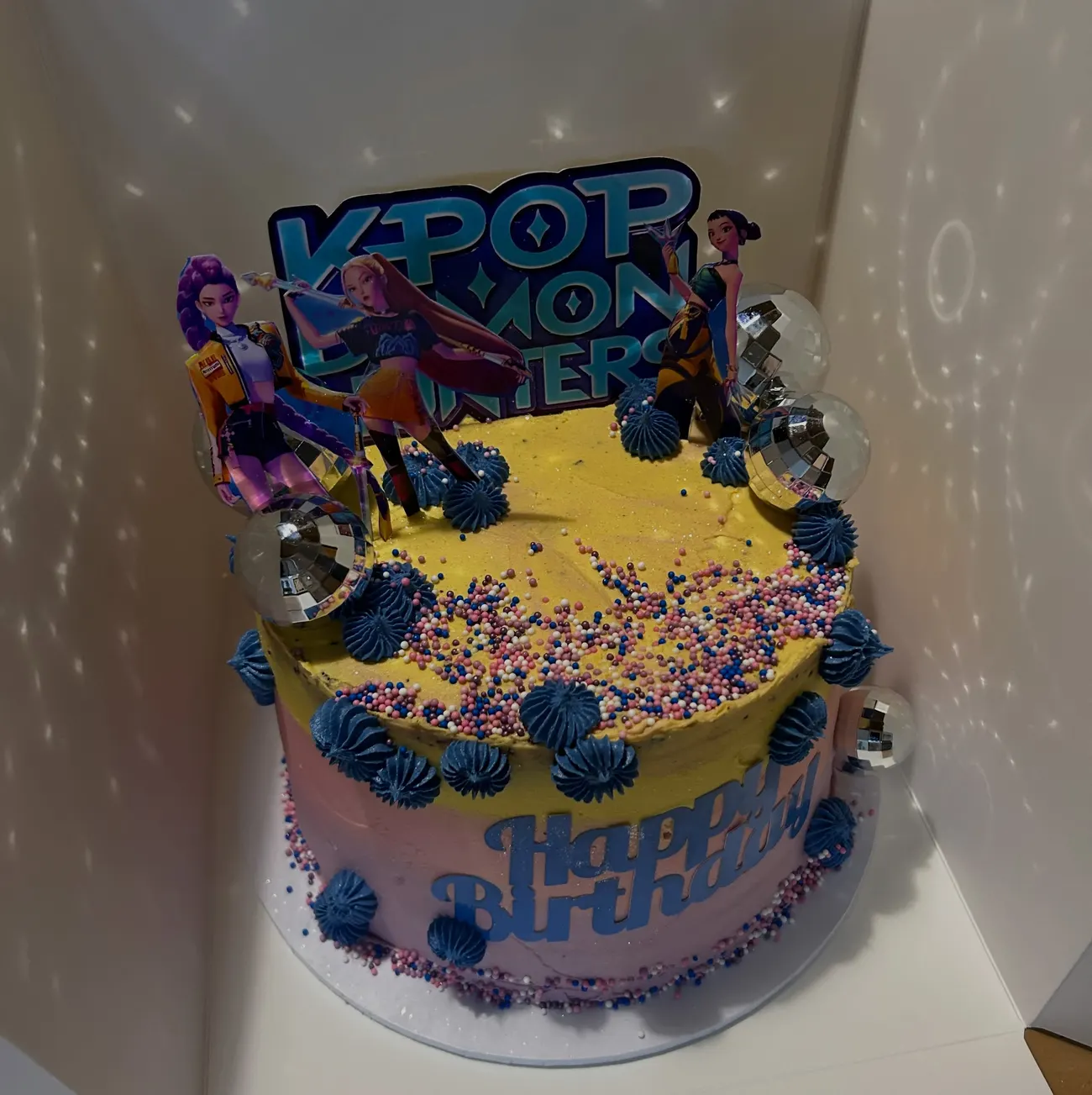 Kpop Demon Hunters themed birthday cake with disco balls by Cakes by PG